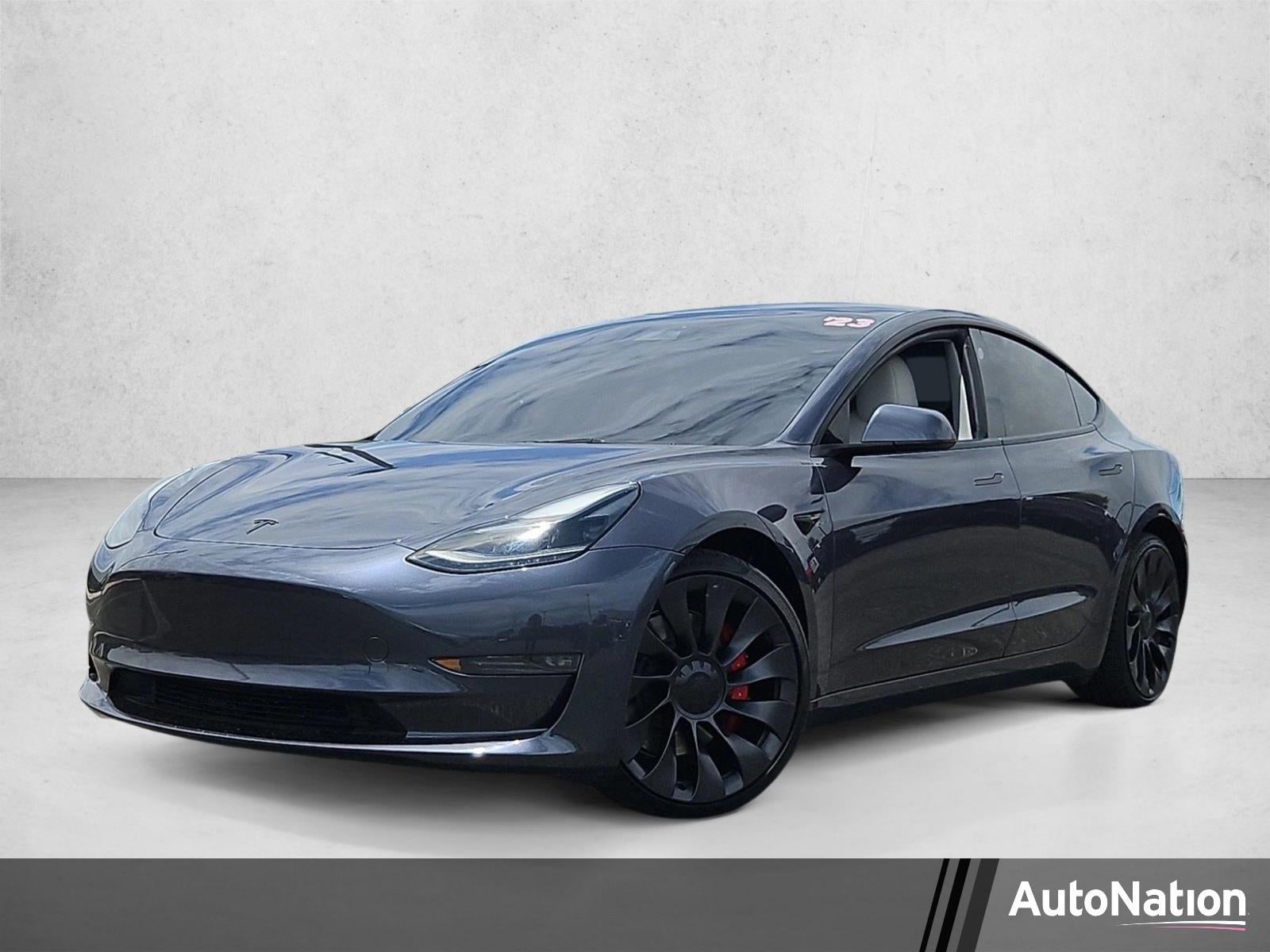 2023 Tesla Model 3 Performance in Black — front three-quarter view